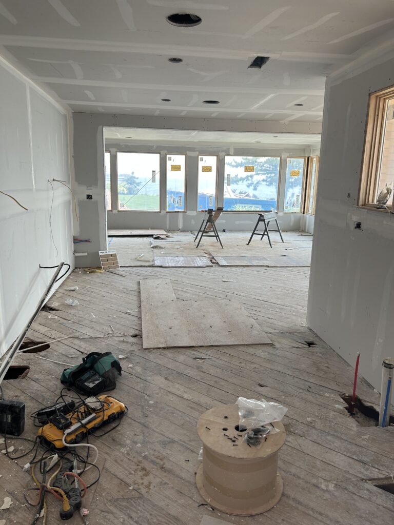 Terrazzo floors being installed during kitchen remodel, highlighting pattern and neutral tones