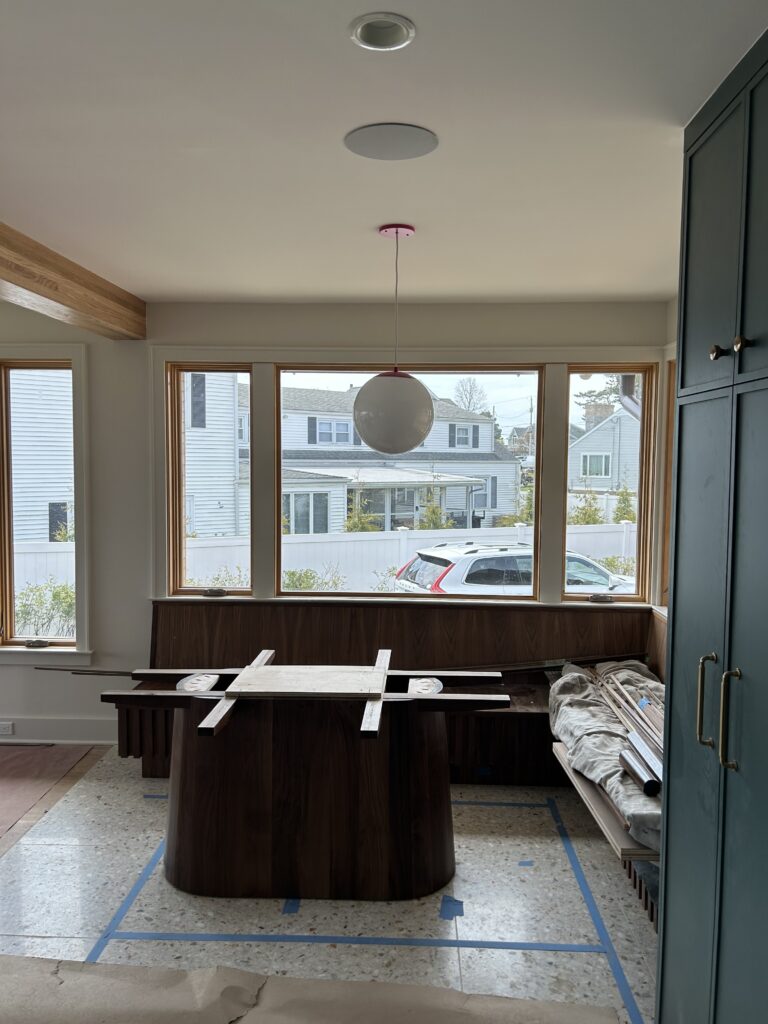 Custom breakfast nook under construction with built-in seating in kitchen remodel