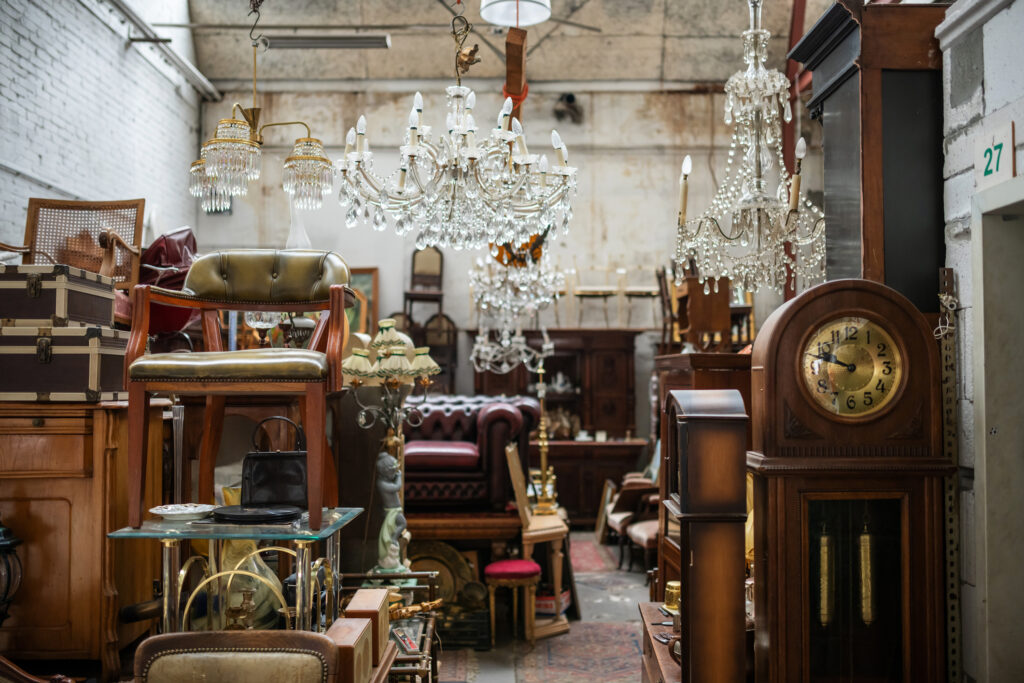 "Eclectic thrift store interior filled with furniture, art, and decor pieces, inspiring mix-and-match home styling